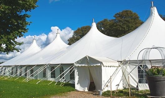 a line of sleek and modern portable restrooms ready for use at an upscale corporate event in Spring Bay